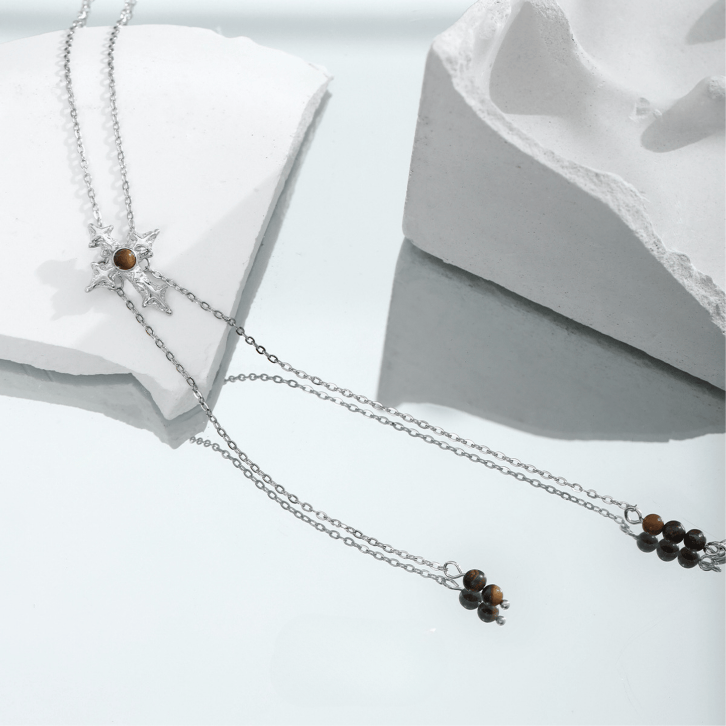 Collier croix œil de tigre avec chaîne à tirer